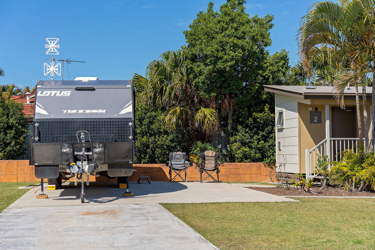 Caravan parked on a concrete ensuite site at Brisbane Holiday Village.