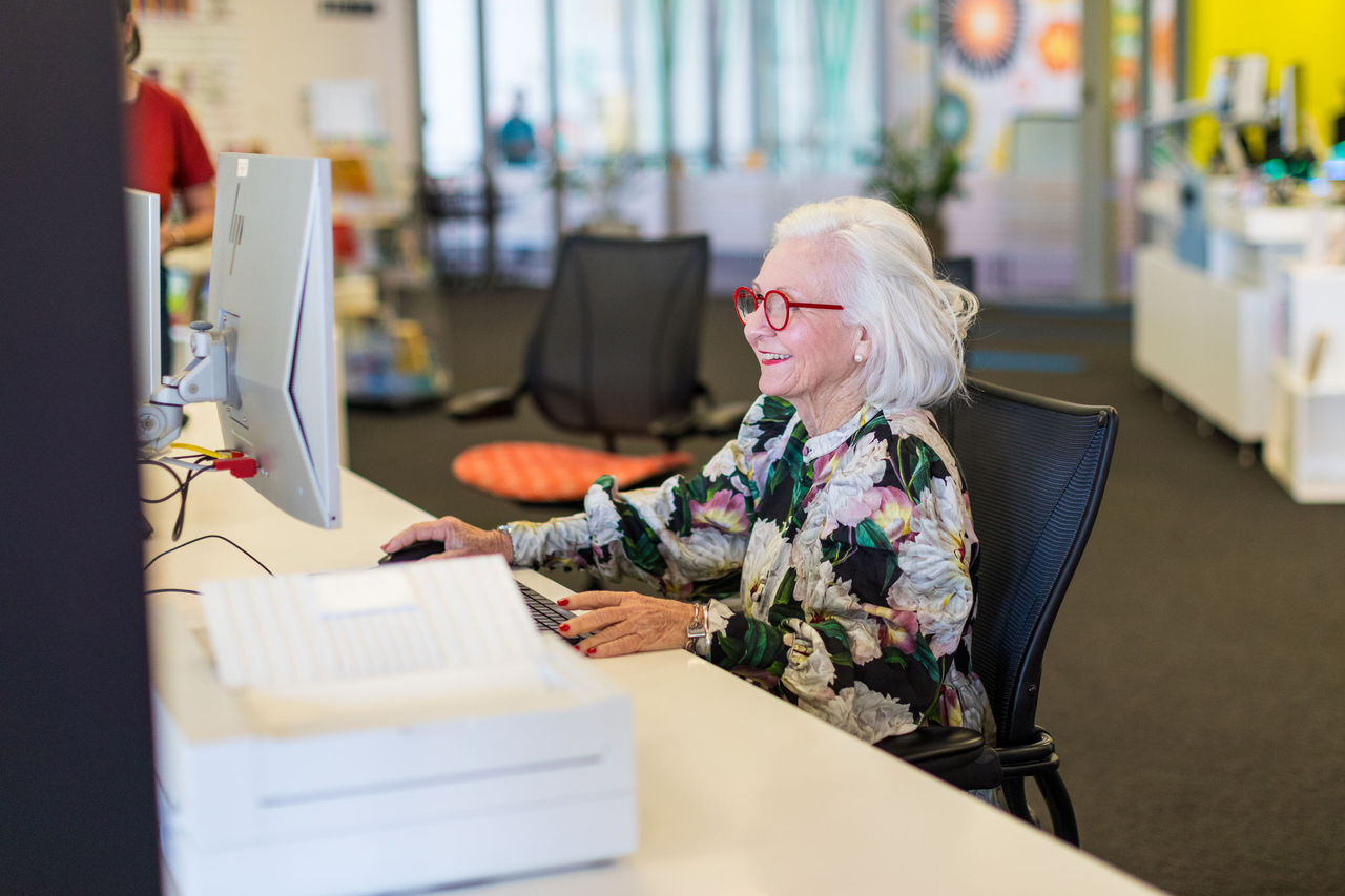 Senior woman using computer at Wynnum Library.