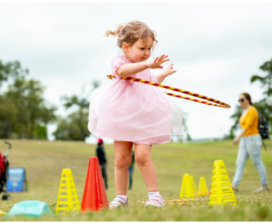 Girl playing with a hoola-hoop