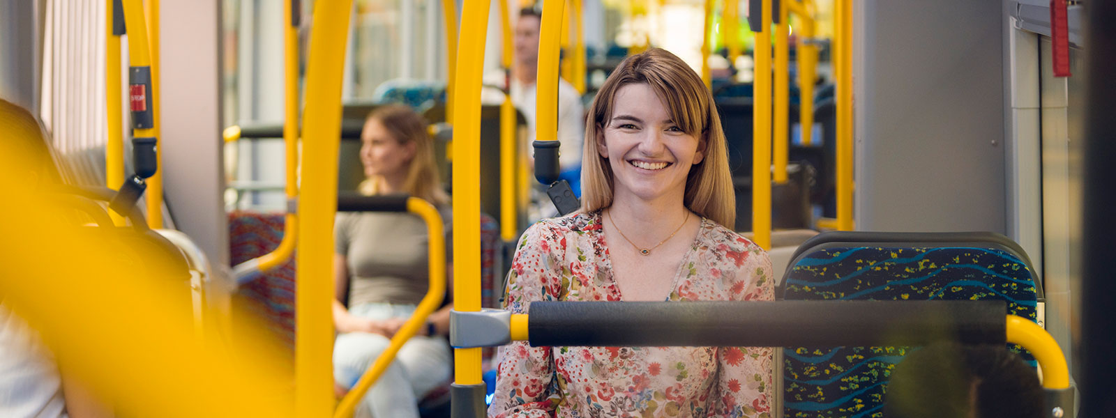 Smiling woman on board a metro 