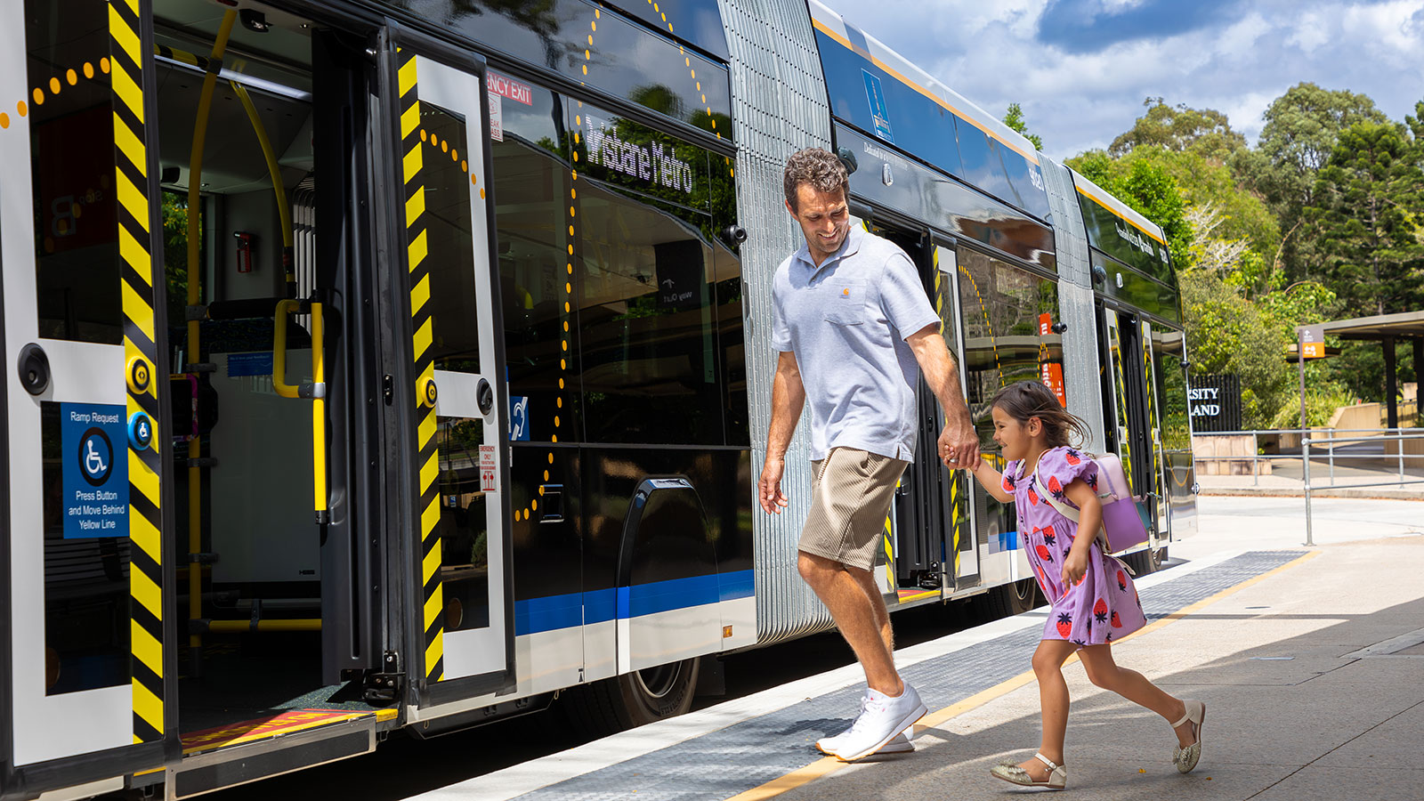 Father and daughter boarding metro