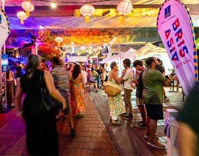 Crowd of festival attendees amongst market stalls at the Lush on Fish Lane festival