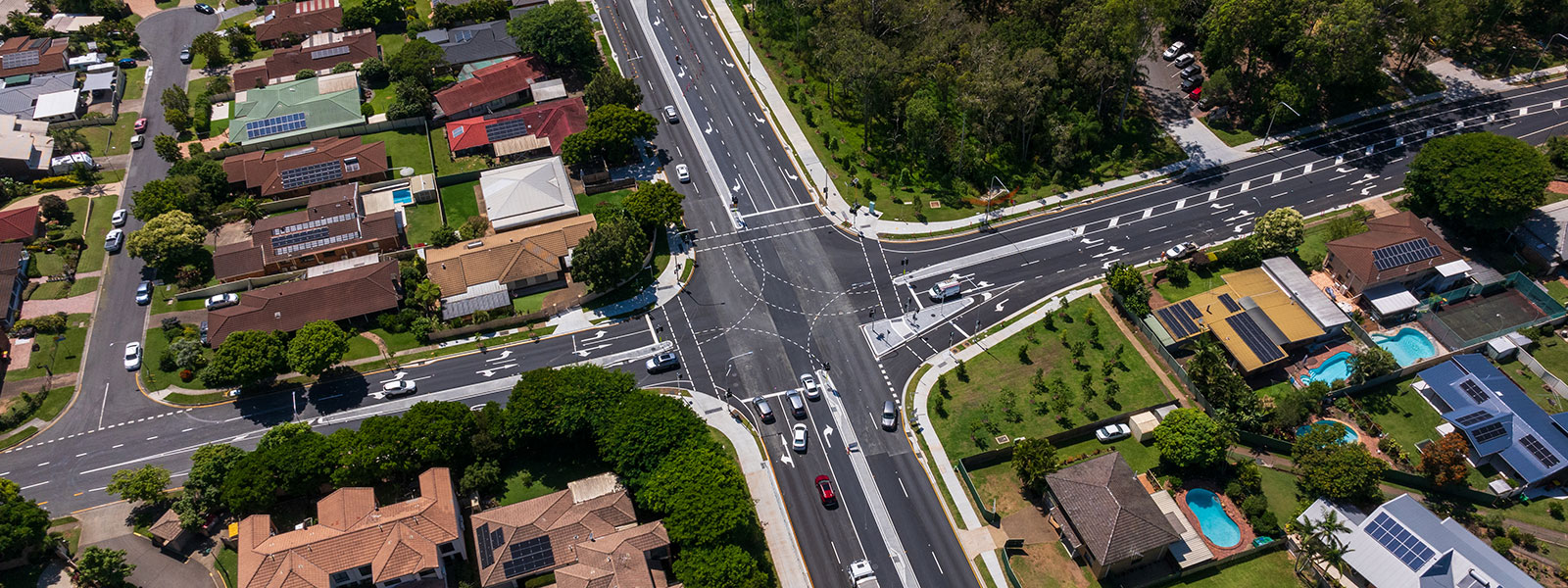 The image shows a birdseye view of the intersection of Dorville Road and Beams Road. Dorville Road runs north-south and Beams Road runs west-east. The image highlights to new intersection and with new traffic lights and road line marking.