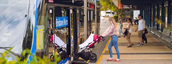 Lady with pram boarding metro