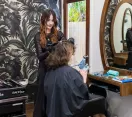 Hairdresser at Bach Hair salon doing a customers hair