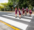 Children walking across a zebra crossing